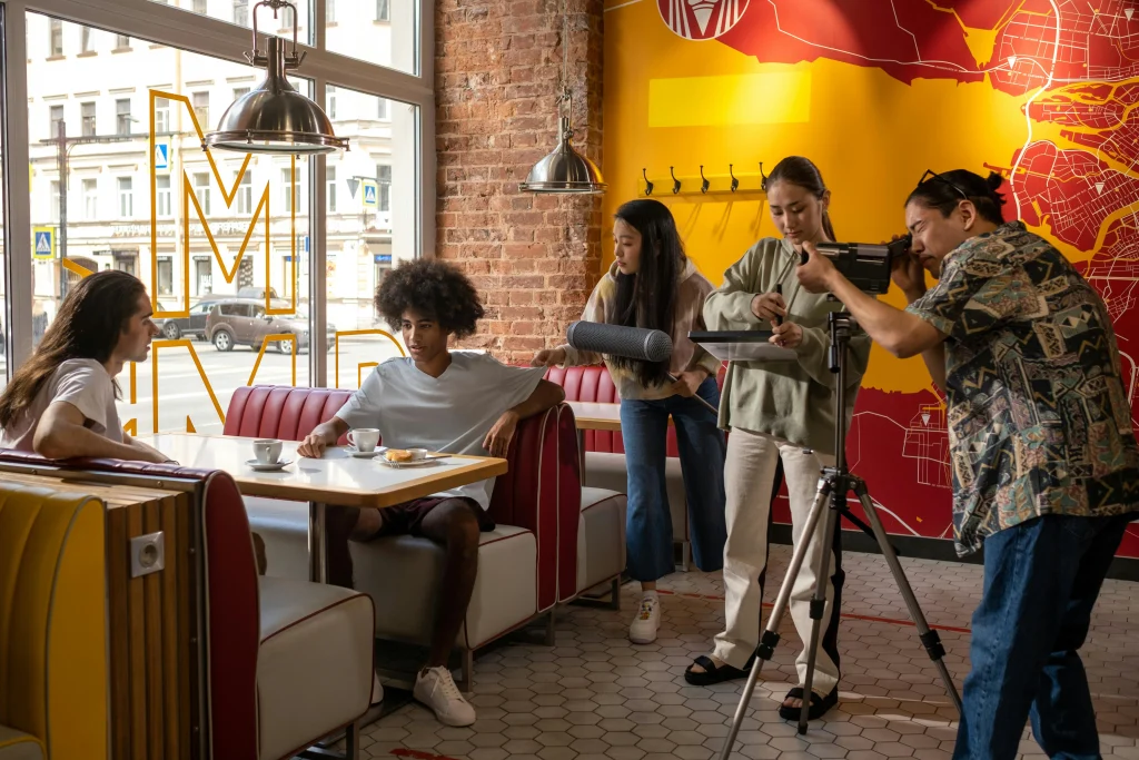 People recording in a restaurant fro social media content purposes. 